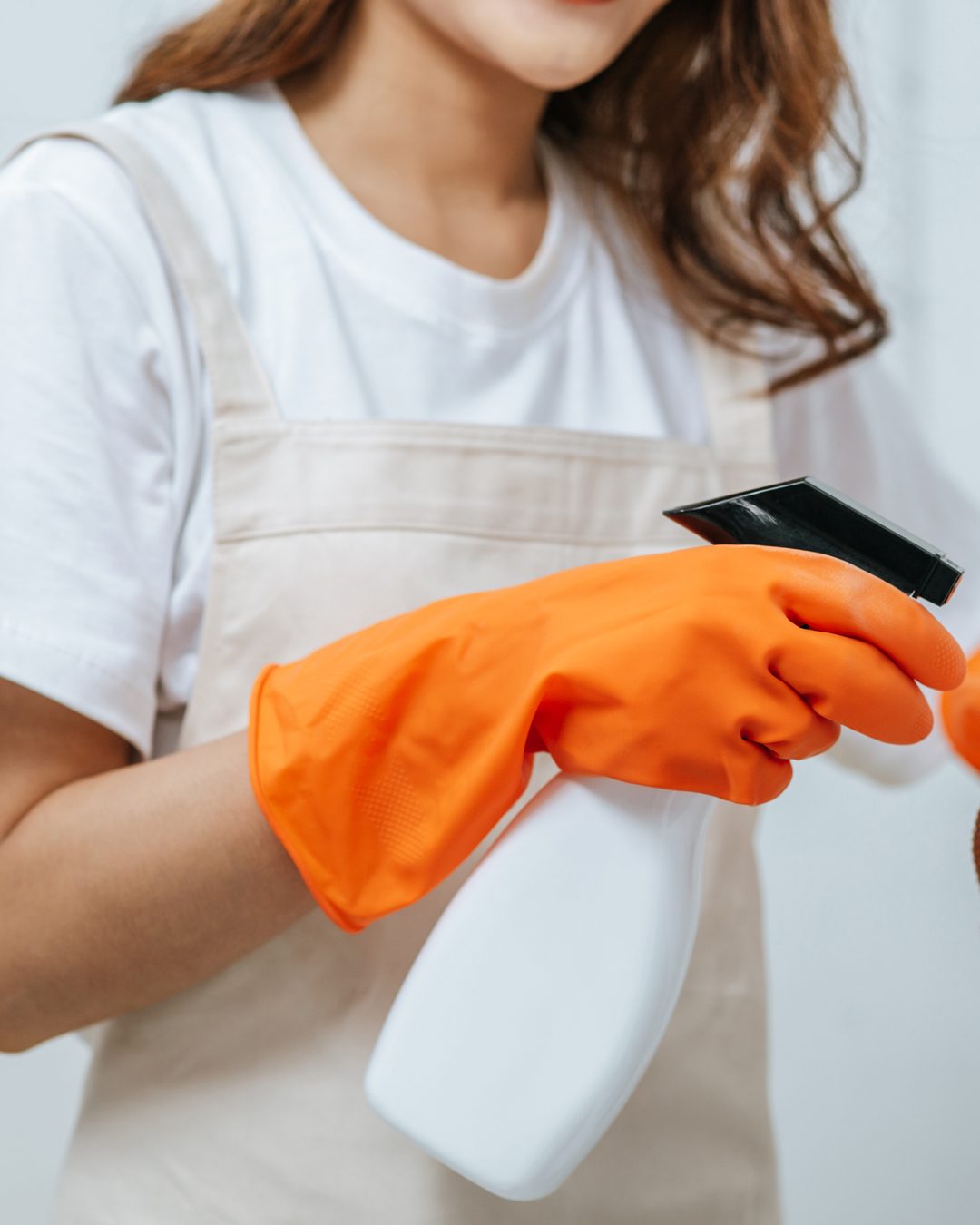 close-up-hand-young-housekeeper-woman-rubber-gloves-use-cleaning-solution-spray-bottle-white-furniture-use-cloth-clean-it